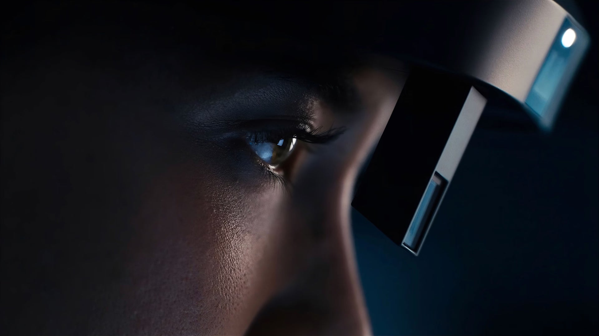 Close-up of a person using the RealWear Arc 3 in a dark setting