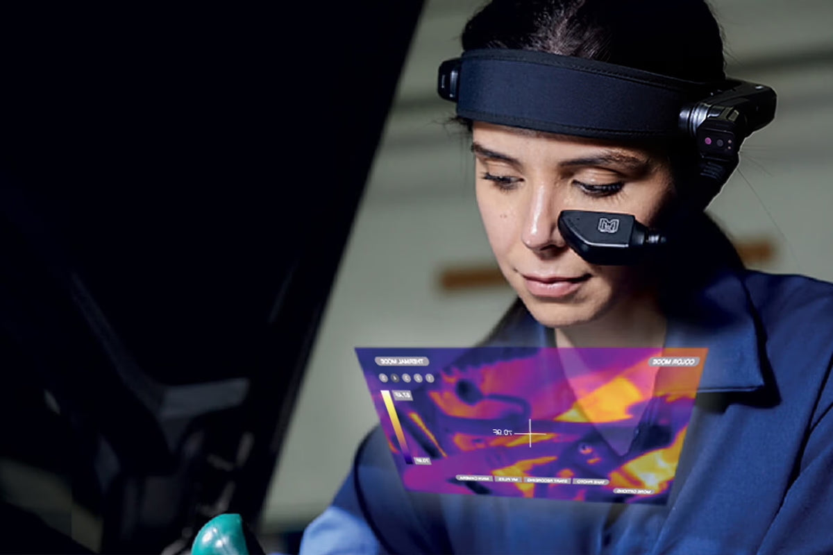 Person wearing the 
RealWear Navigator® 520 and thermal camera module add on interface displayed on a screen.